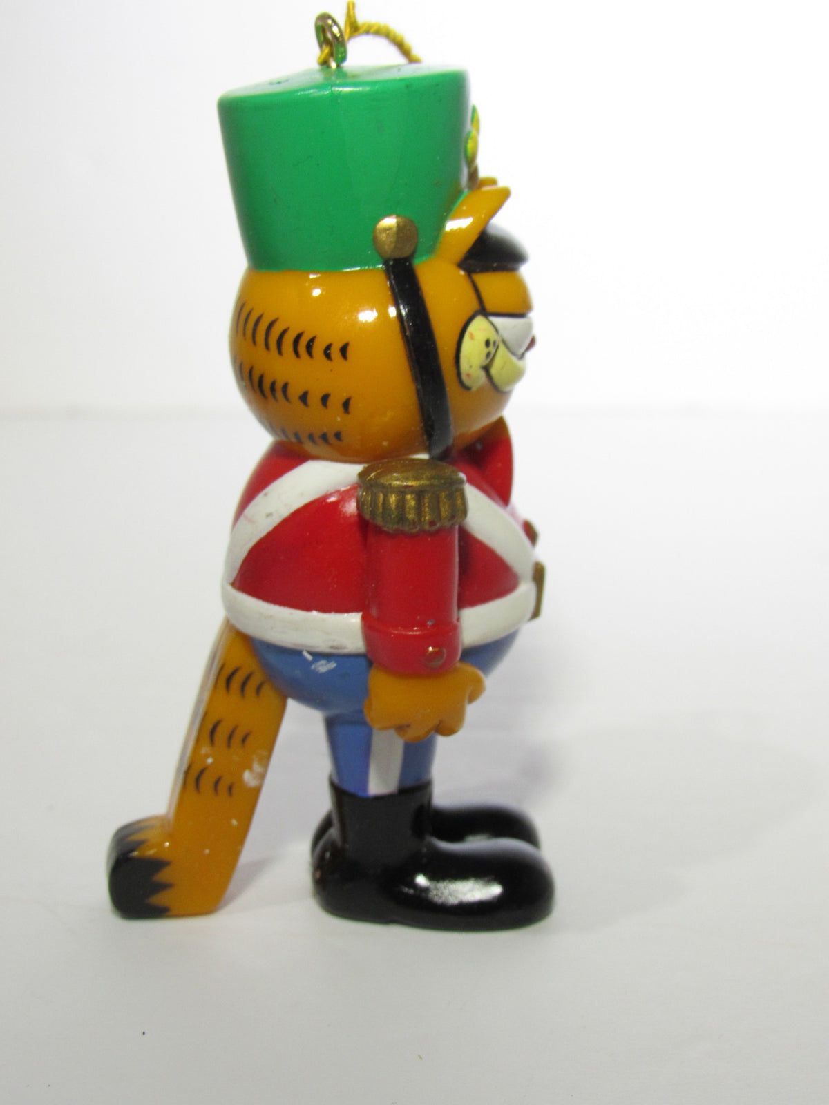 Another side view of the 1978 VTG Enesco Treasury of Christmas Ornament featuring Garfield as The Nutcracker, displaying the unique design in vivid colors.