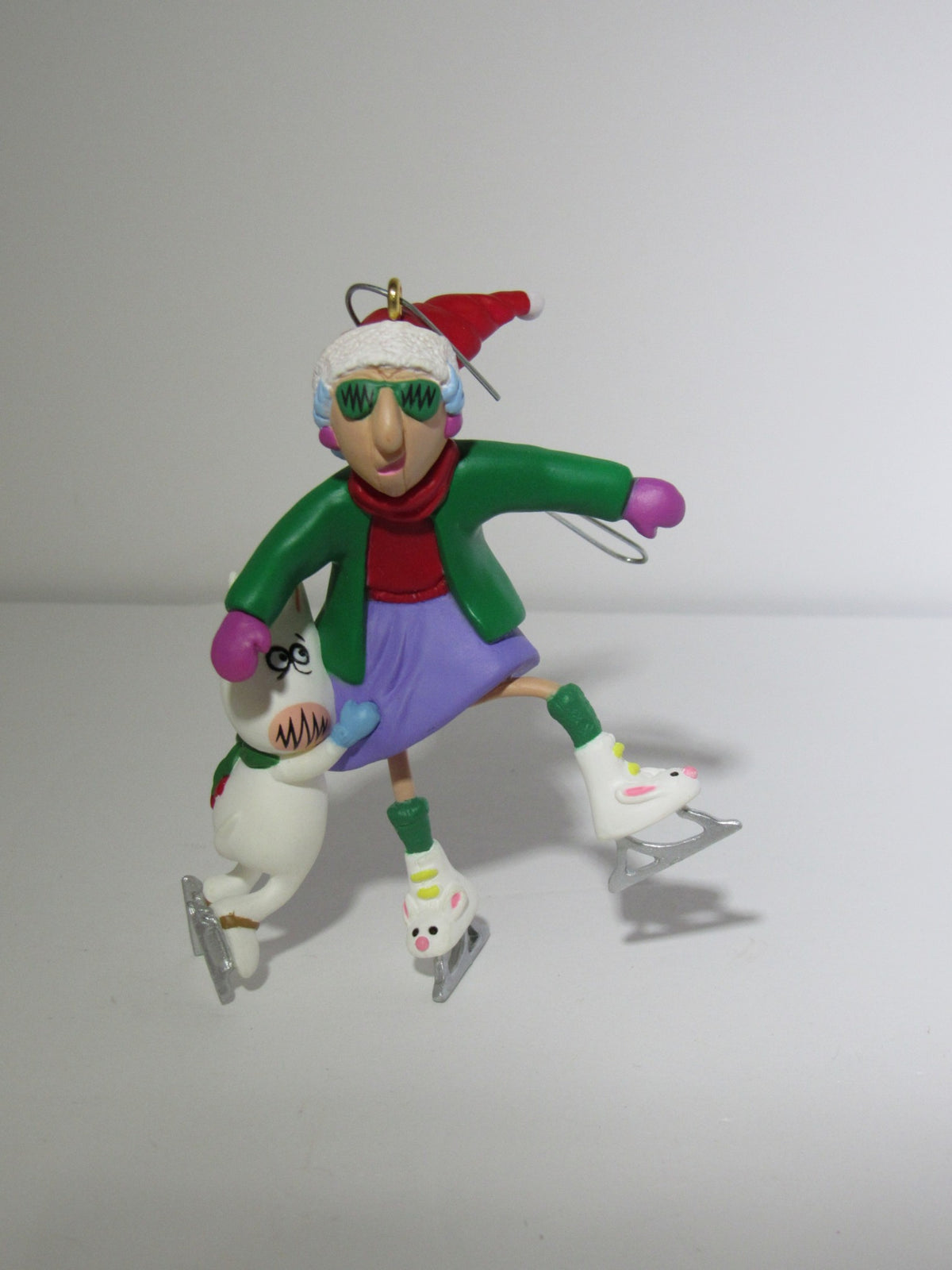 Close-up of Hallmark Keepsake Ornament Maxine on Thin Ice 1999. The ornament features Maxine in a festive outfit with sunglasses skating with a snowman, showcasing her fun and sassy personality.