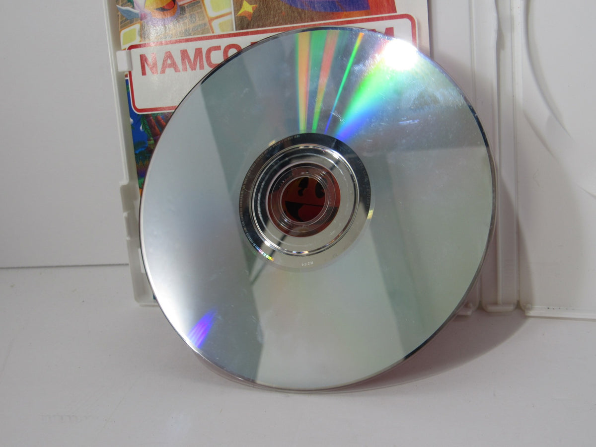 Close-up of the game disc for 2007 Namco Museum Remix for Nintendo Wii, highlighting its reflective surface and vibrant design.