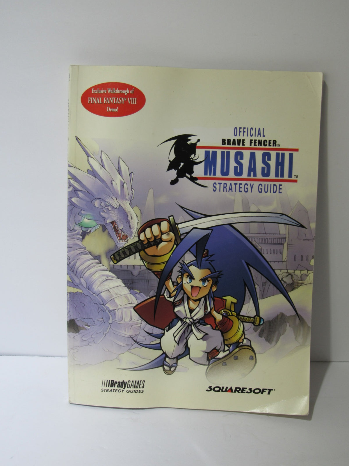 Cover of the Brady Games Squaresoft Official Brave Fencer Musashi Strategy Game Guide featuring Musashi character artwork and a promotional banner for the Final Fantasy VIII demo.