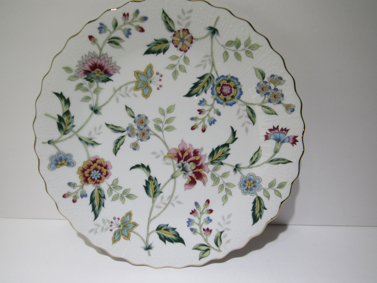 A beautifully crafted porcelain cake plate featuring an intricate floral pattern edged in gold, part of the VTG Andrea by Sadek Porcelain Cake Plate & Server Floral Pattern Japan Made NEW.