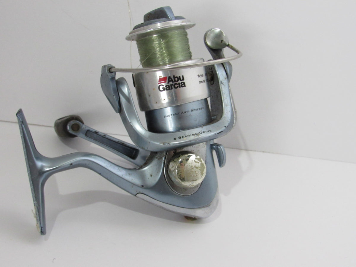Abu Garcia Cardinal 6 Bearing Spinning Reel featuring instant anti-reverse function and a gear ratio of 5.1:1, showcased in excellent vintage condition with light wear.