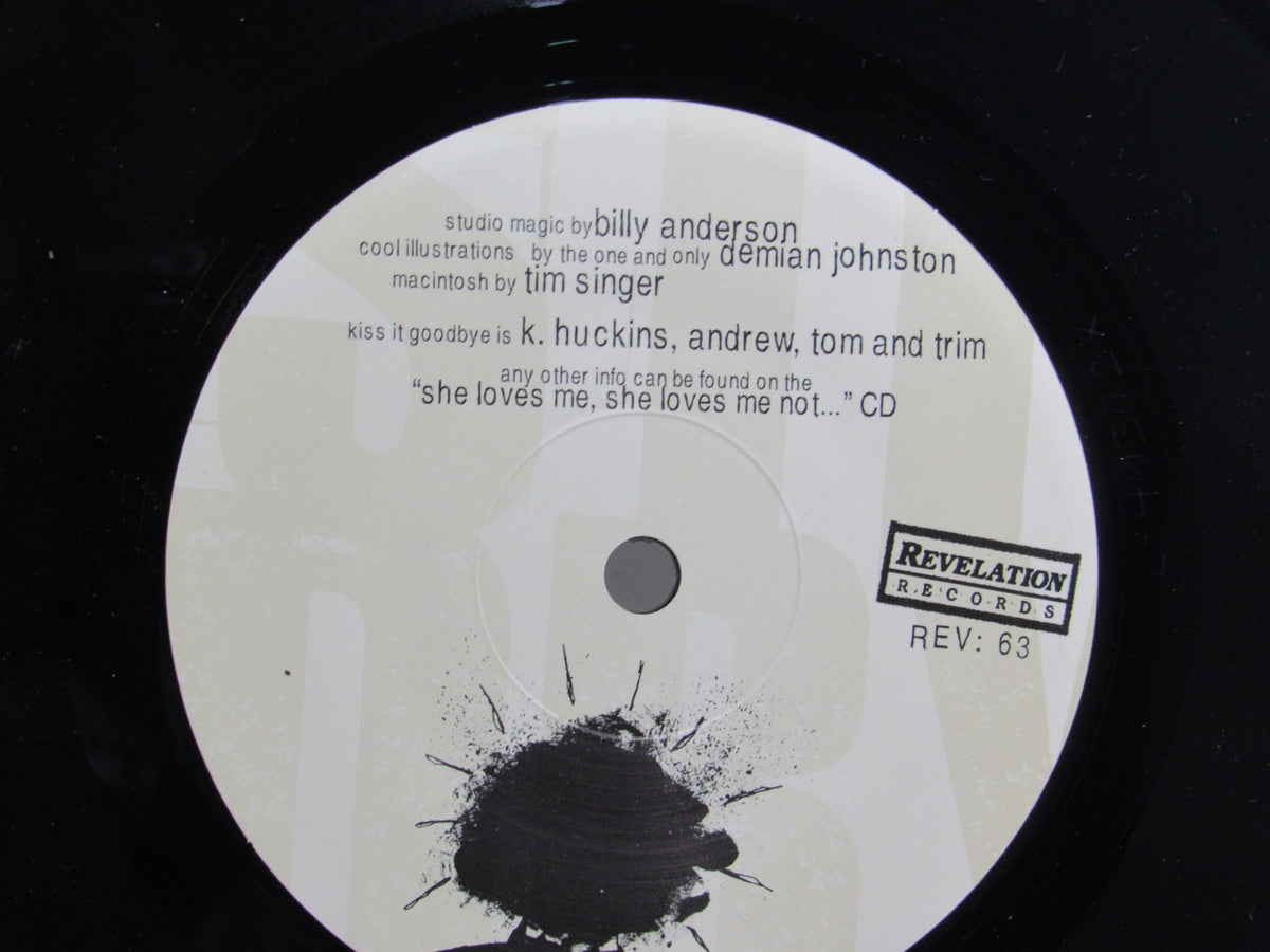 Close-up of the label on the Kiss It Goodbye: Target Practice 7" single vinyl, displaying artist details and features.