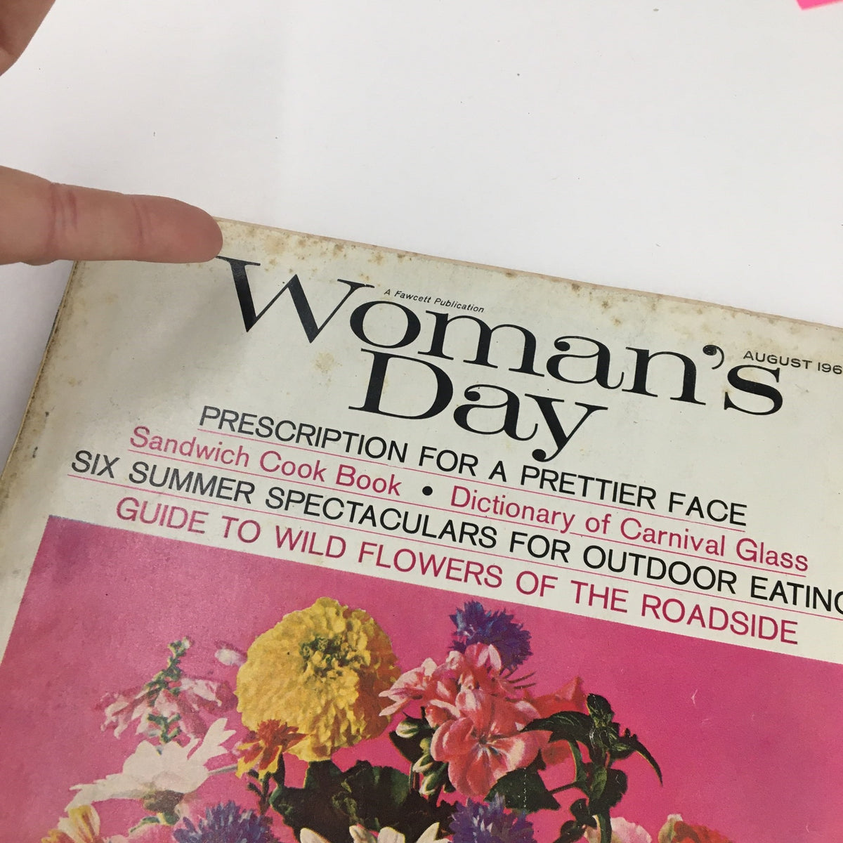 Cover of Woman's Day Magazine from August 1965 showcasing the title, 'Woman's Day', and a captivating floral design alongside the 'Guide to Wild Flowers of the Roadside' feature.