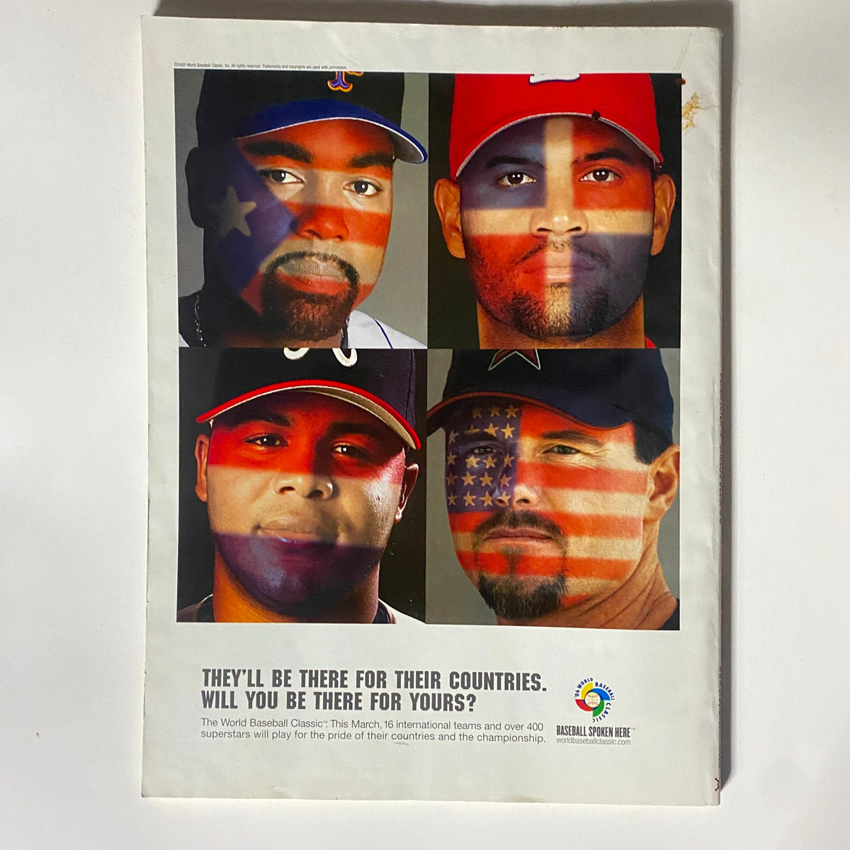 Advertisement from Street & Smith's Baseball Magazine 2006, illustrating international baseball players with painted flags, promoting unity in the sport.