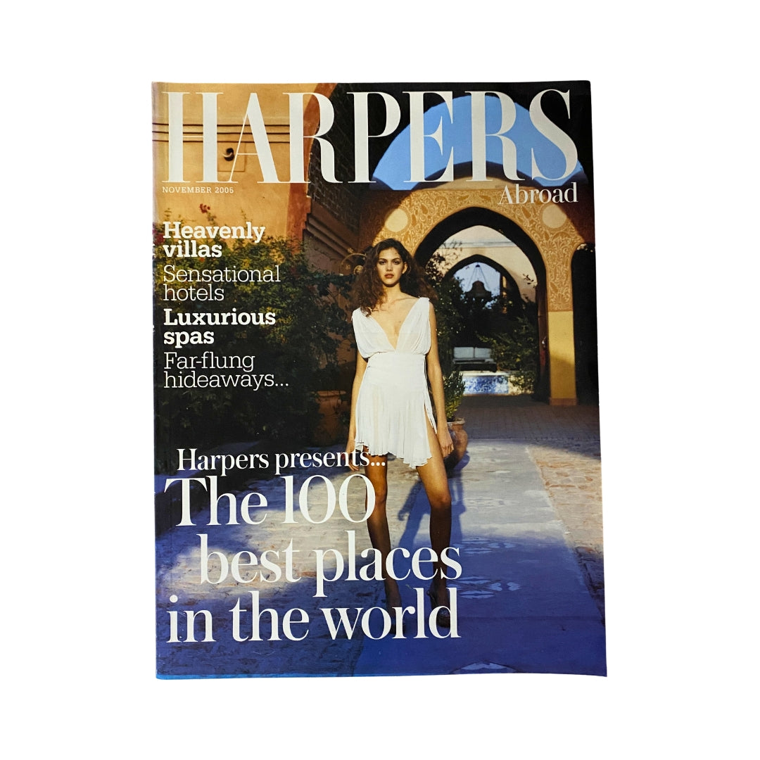 Harpers Abroad Magazine November 2005 cover featuring the title 'The 100 Best Places in the World', showcasing a model in a stylish white dress in an elegant outdoor setting.