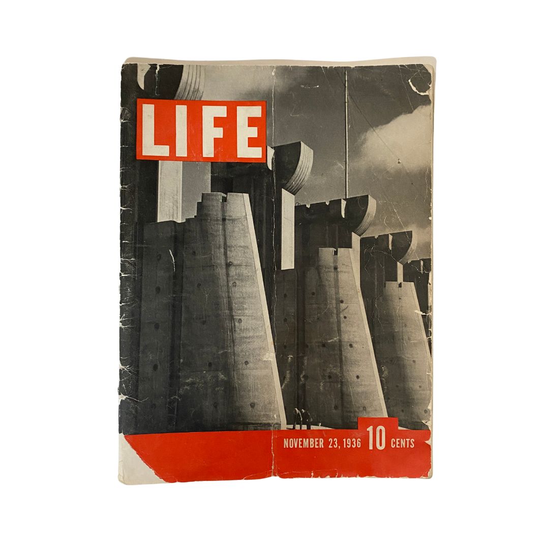 Cover of VTG Life Magazine November 23, 1936, featuring the Fort Peck Dam which highlights engineering advancements. The magazine showcases a dramatic black and white image with red accents.