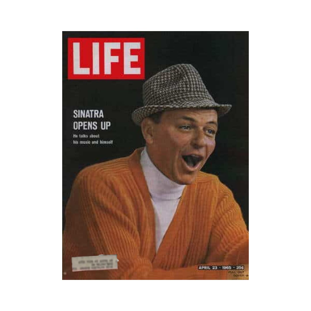 Cover of VTG Life Magazine April 23, 1965 featuring Frank Sinatra, showcasing the headline 'Sinatra Opens Up,' along with a vibrant image of Sinatra in an orange sweater and hat, discussing his music and personal insights.