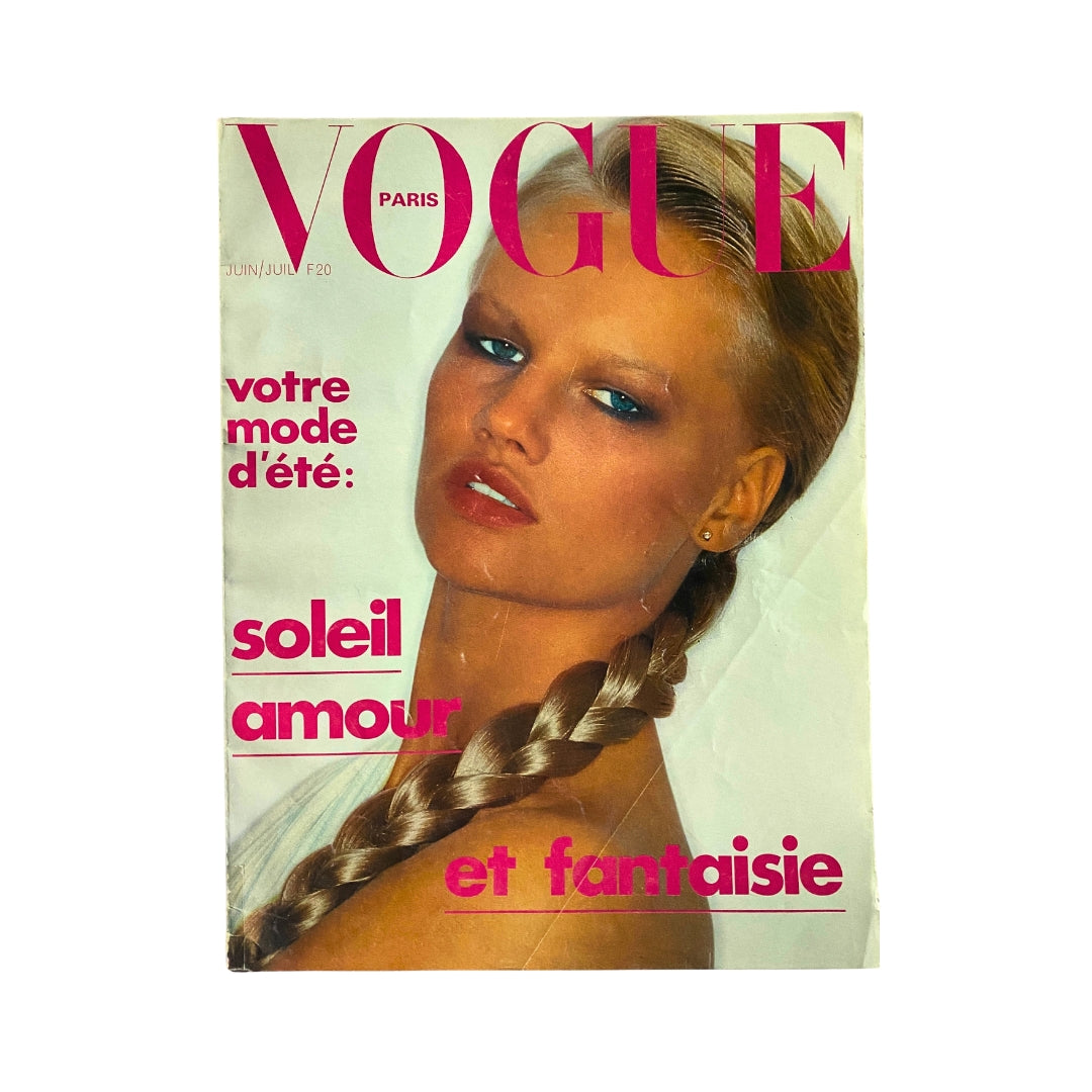 Cover of Vogue Paris Magazine June - July 1976 featuring model Arja Toyryla, showcasing vibrant summer fashion with bold color palettes. Classic vintage magazine reflecting 1970s style.