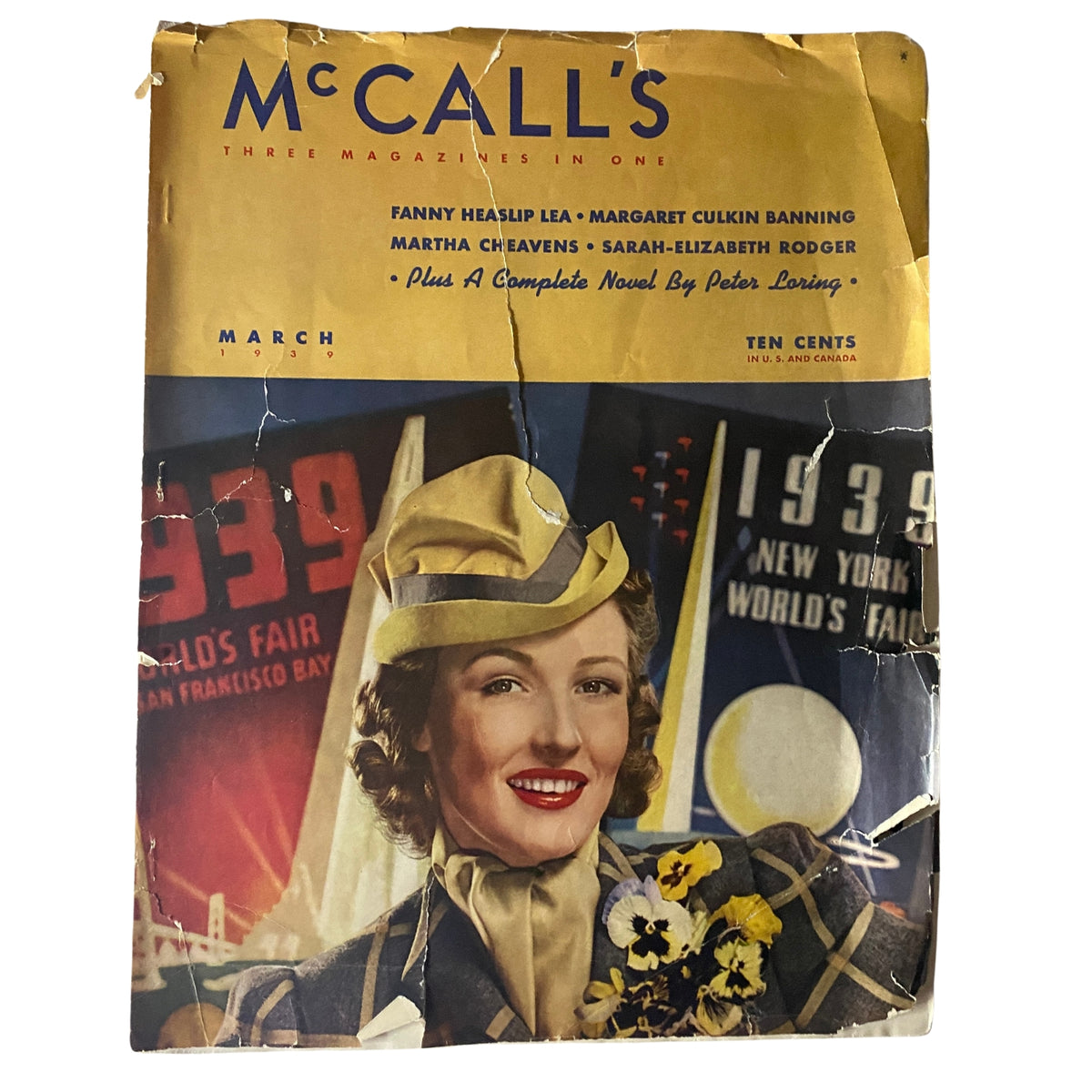Cover of McCall's Magazine March 1939 featuring a smiling woman in a stylish hat, highlighting cultural themes of the 1930s with elements of the New York World's Fair.