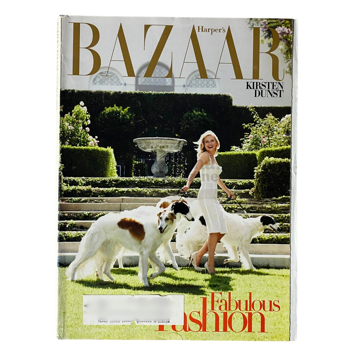 Harper's Bazaar Magazine October 2008 featuring Kirsten Dunst on the cover, showcasing fashion trends with a scenic garden backdrop.