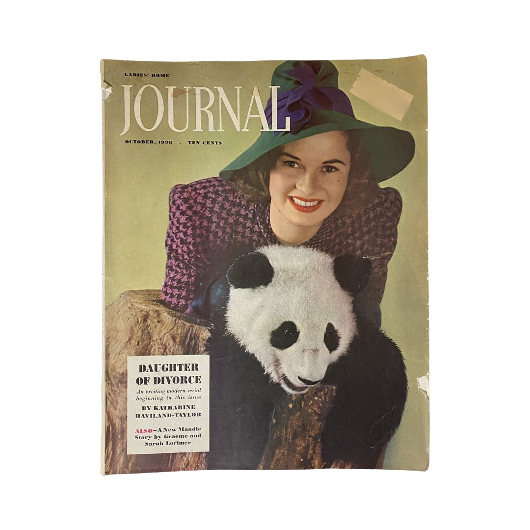 Cover of Ladies' Home Journal Magazine, October 1938, featuring the title and the story 'Daughter of Divorce'. The cover shows a woman in a stylish hat holding a panda, providing a glimpse into vintage fashion and culture.