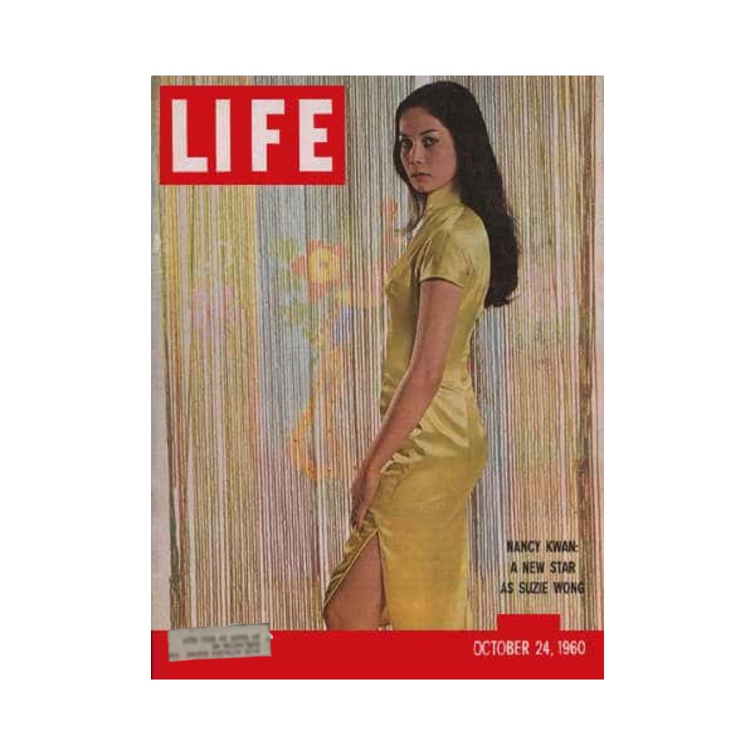 Cover of VTG Life Magazine from October 24, 1960, featuring Nancy Kwan as Suzie Wong, showcasing a vintage fashion moment in a striking yellow dress.