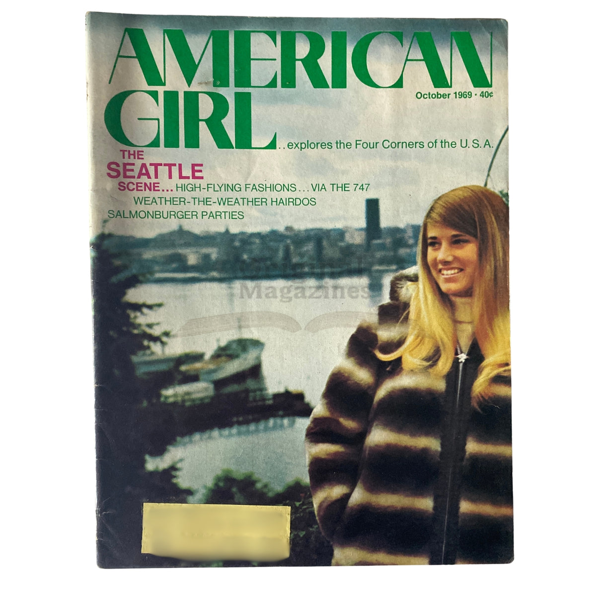 Cover of American Girl Magazine, October 1969, featuring The Seattle Scene and High-Flying Fashions, showcasing a woman in a fur coat with Seattle skyline in the background.