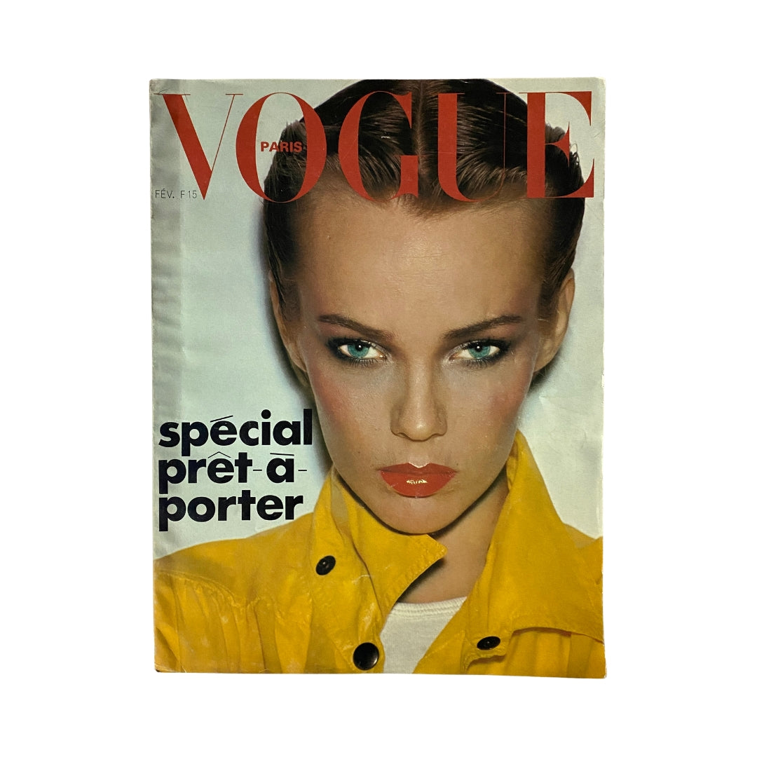 Vogue Paris Magazine February 1976 featuring Sofia Kiukkonen on the cover, showcasing a model with striking makeup and a yellow jacket, representing vintage fashion.