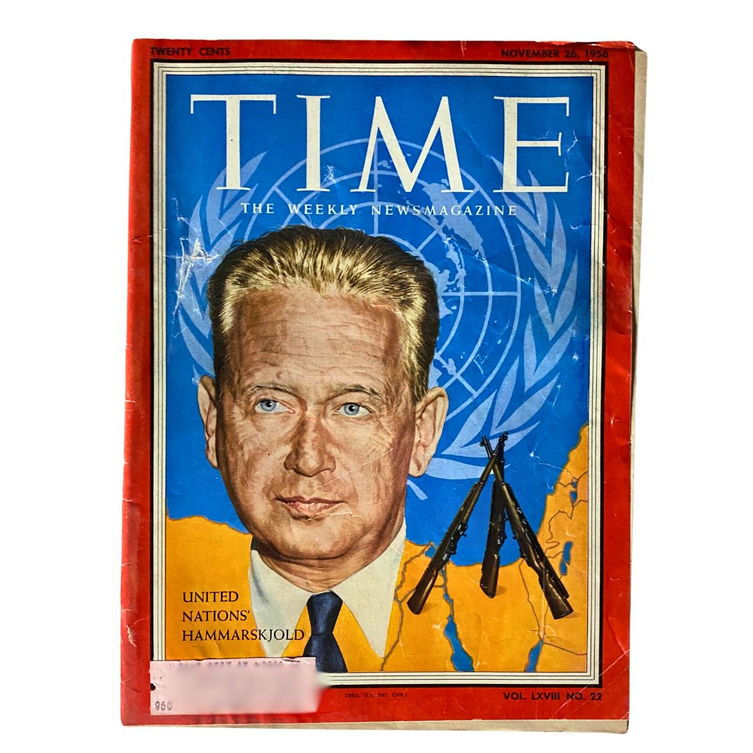 VTG Time Magazine November 26, 1956 cover featuring Dag Hammarskjöld, Secretary-General of the United Nations, set against a blue and orange background with an emblem and arms.