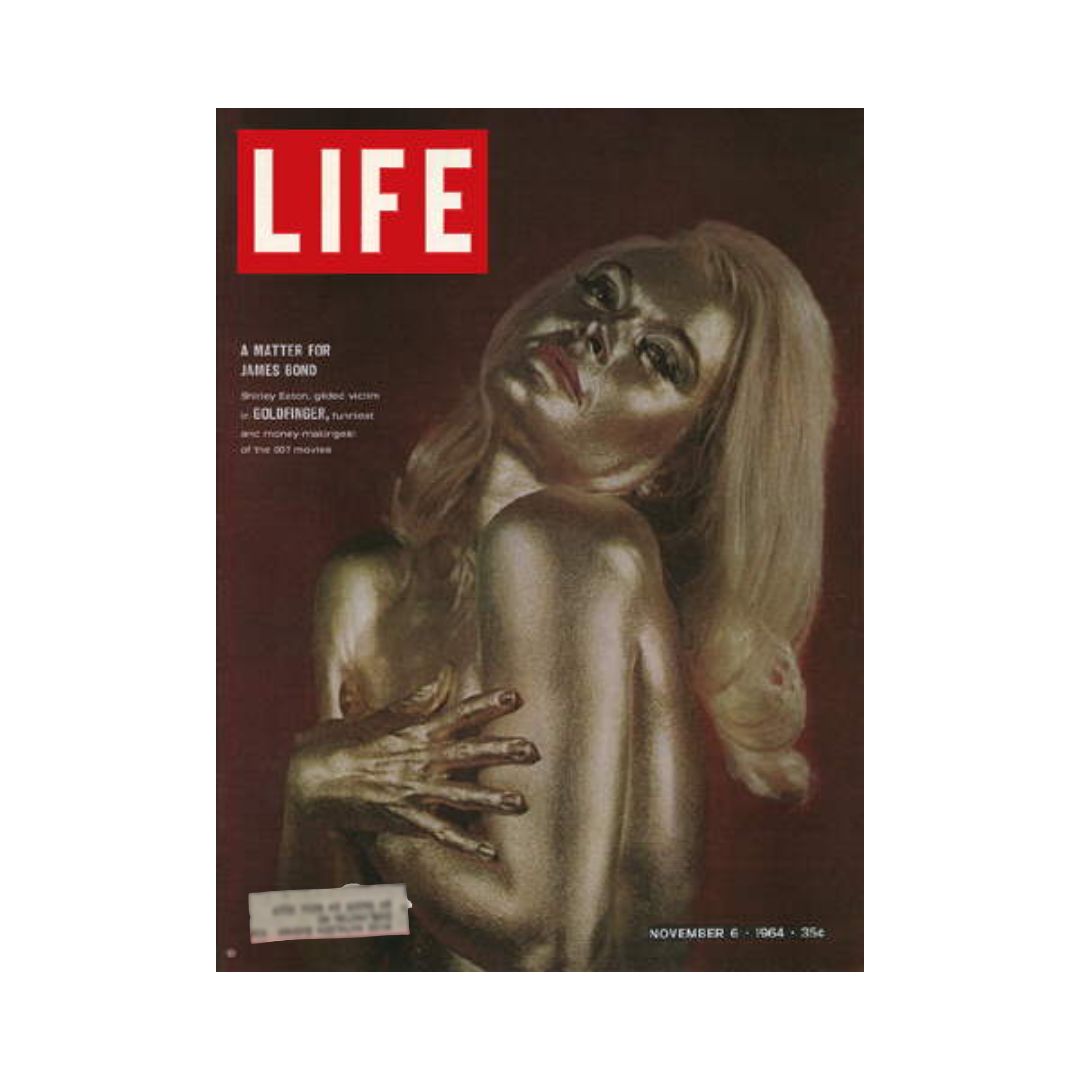 Vintage Life Magazine cover from November 6, 1964, featuring James Bond 007 and Goldfinger, showcasing a golden woman as the iconic image.