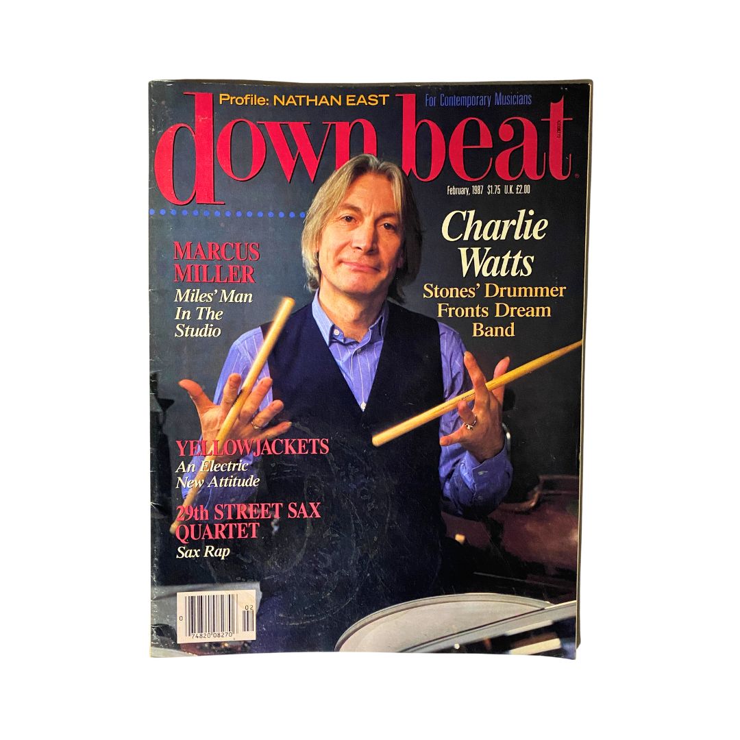 Cover of VTG Down Beat Magazine February 1987 featuring Charlie Watts, the drummer of The Rolling Stones, holding drumsticks and smiling.