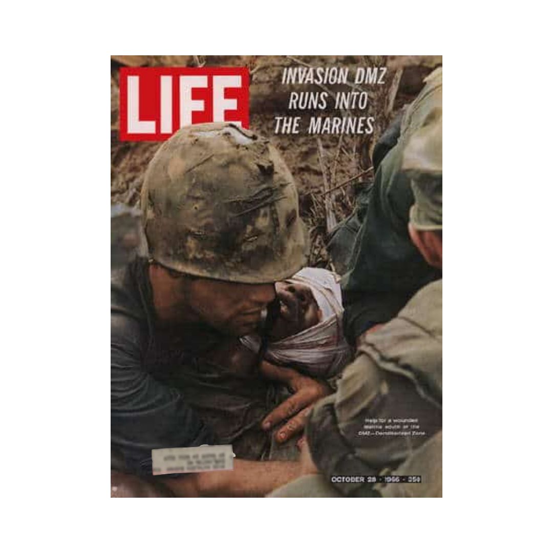 Cover of Life Magazine from October 28, 1966, featuring the title 'Vietnam Invasion DMZ Runs Into Marines', depicting U.S. Marines in a dramatic scene during the Vietnam War.