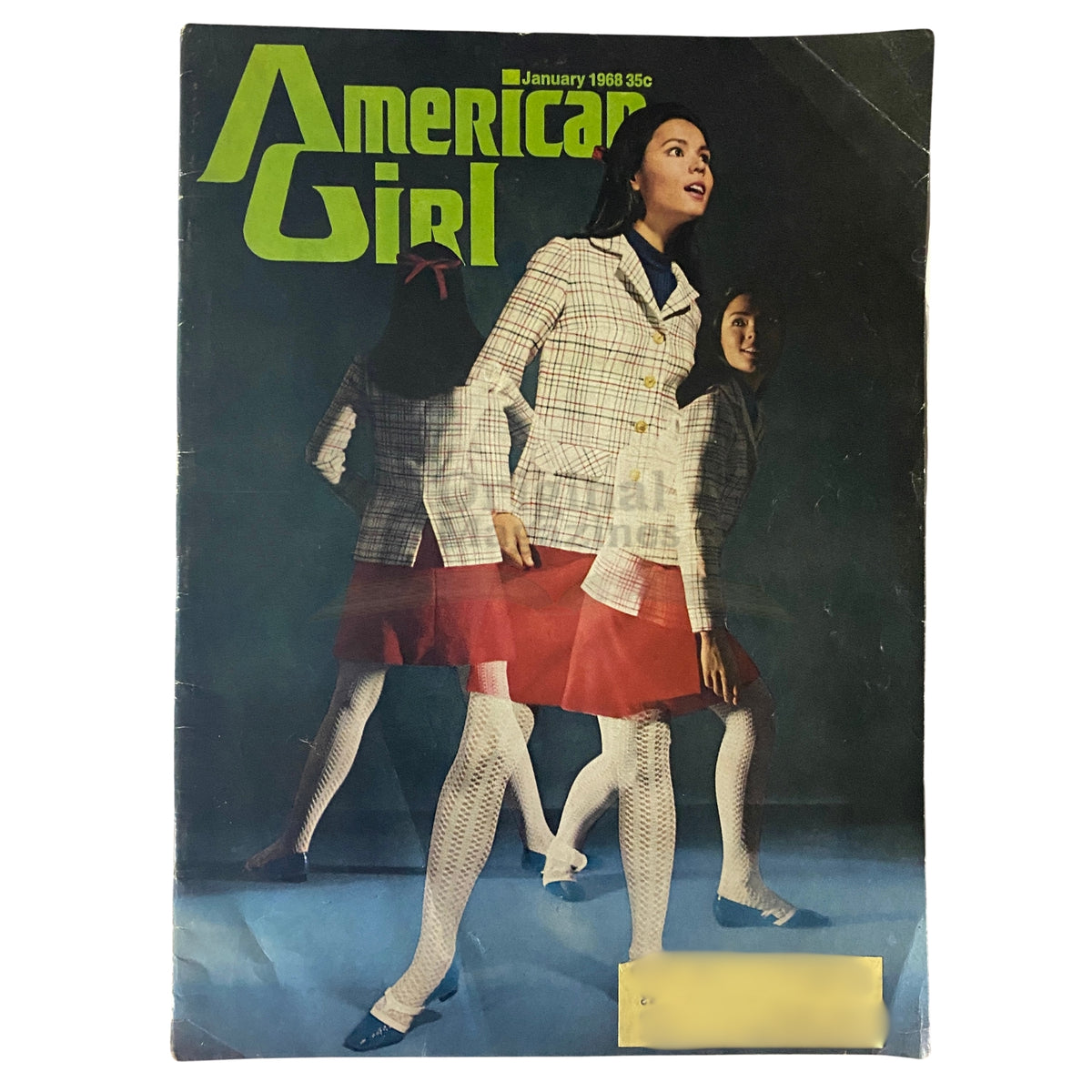 Cover of American Girl Magazine January 1968, featuring a model in a plaid jacket and red skirt, highlighting the vibrant style of the late 1960s.