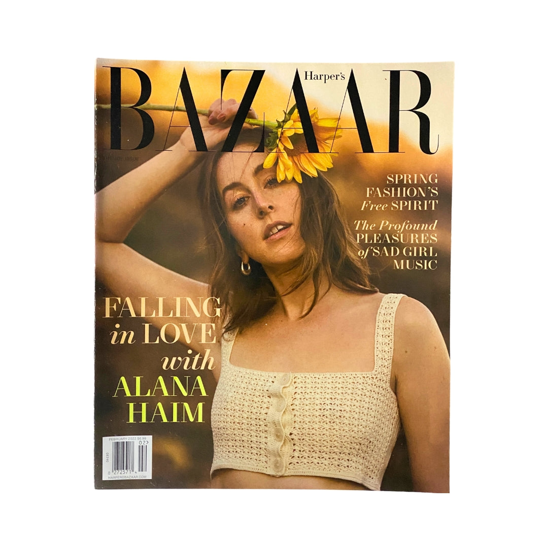 Cover of Harper's Bazaar Magazine February 2022 featuring Alana Haim, showcasing her in a stylish outfit with sunflowers in the background.