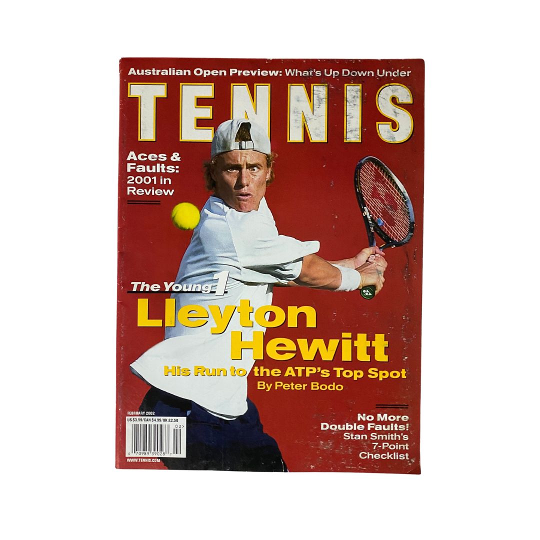 Tennis Magazine February 2002 Lleyton Hewitt Cover showcasing Lleyton Hewitt in action with a tennis racket, featuring bold title and striking red background.