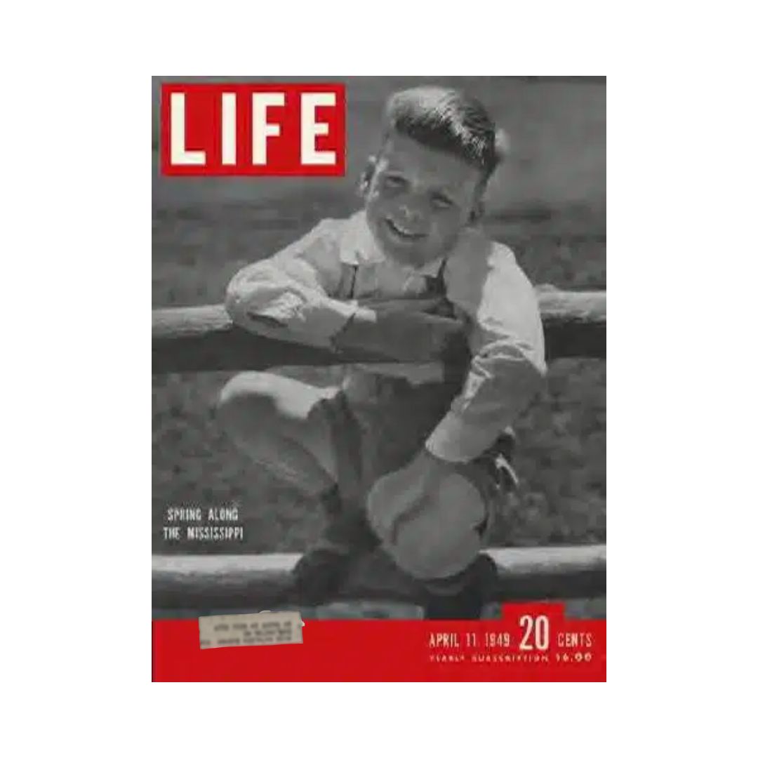 VTG Life Magazine April 11, 1949 cover featuring a young boy smiling by a fence, highlighting the theme 'Spring Along the Mississippi'.