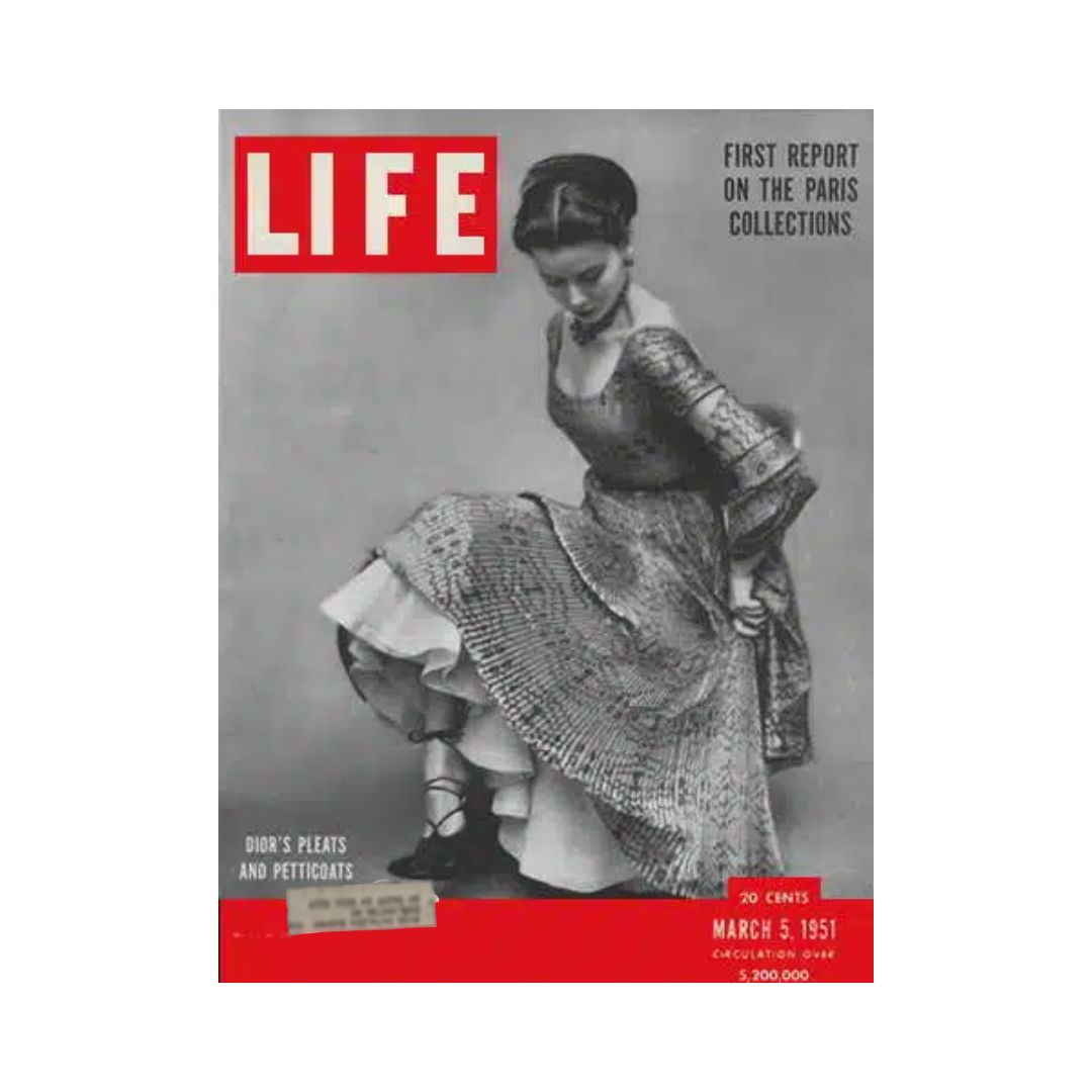 Vintage Life Magazine cover from March 5, 1951, featuring Paris fashion, highlighting Dior's designs with a model showcasing an elegant dress.