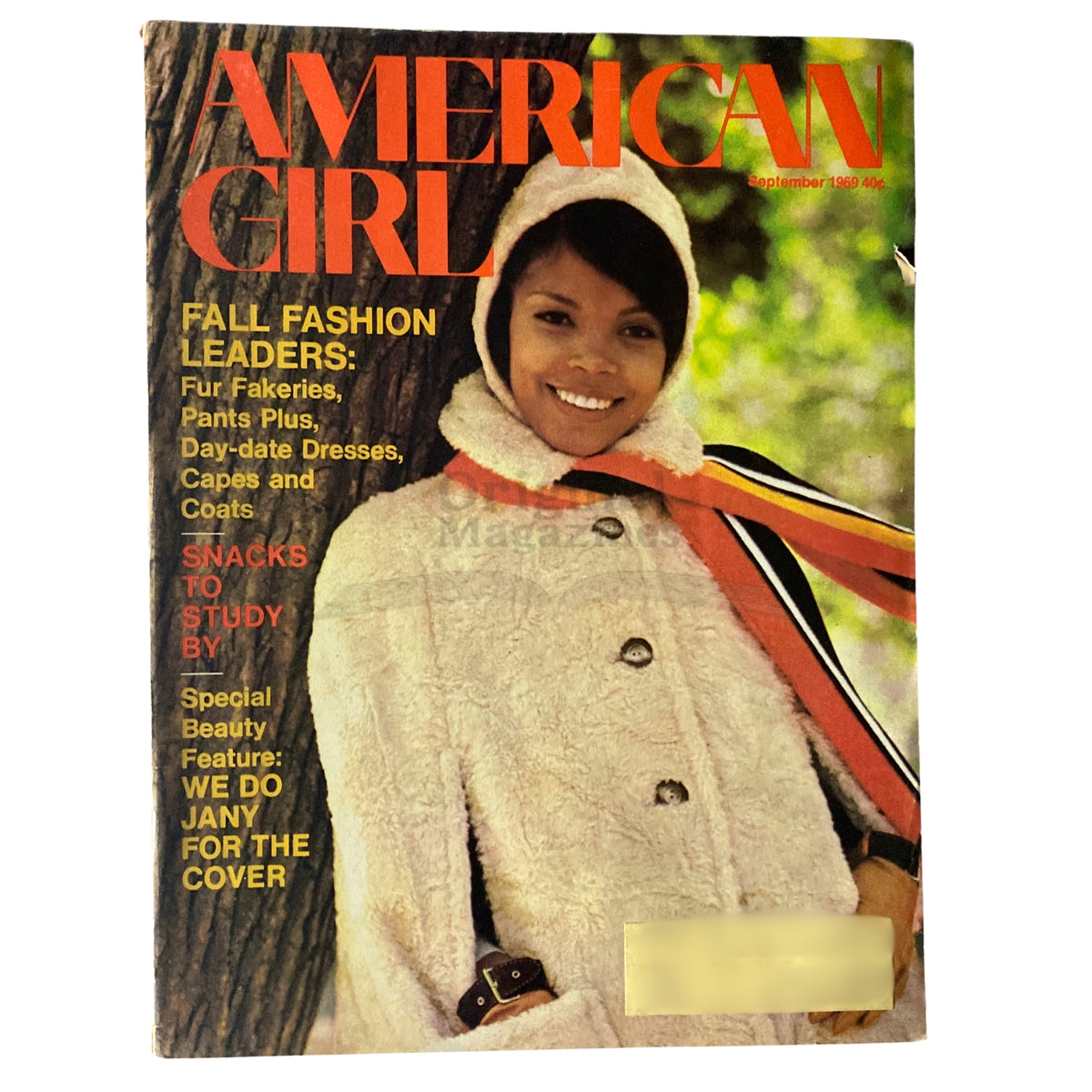 American Girl Magazine September 1969 cover featuring a young girl wearing a stylish fur coat with a scenic outdoor background. The cover text highlights fashion leaders and includes the special beauty feature 'We Do Jany For The Cover.'