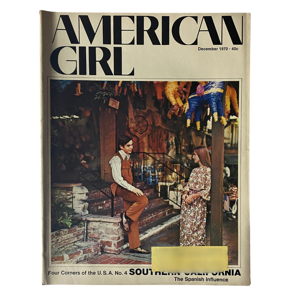Cover of American Girl Magazine December 1970, featuring a young couple in Southern California with Spanish influence decorations, highlighting the rich cultural heritage of the era.