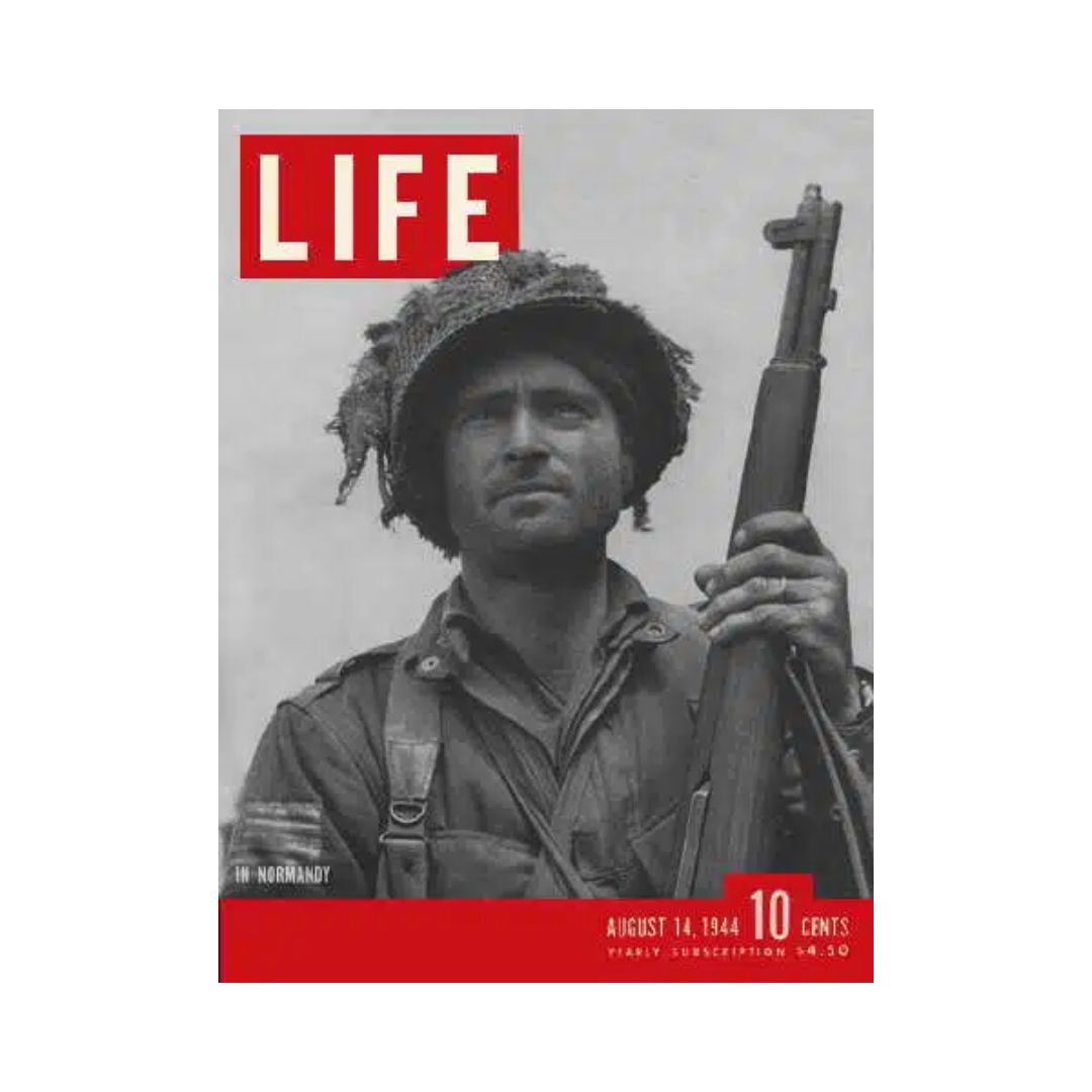 Cover of VTG Life Magazine from August 14, 1944 featuring a soldier in Normandy. The magazine includes the title 'LIFE' prominently displayed, reflecting on World War II events.