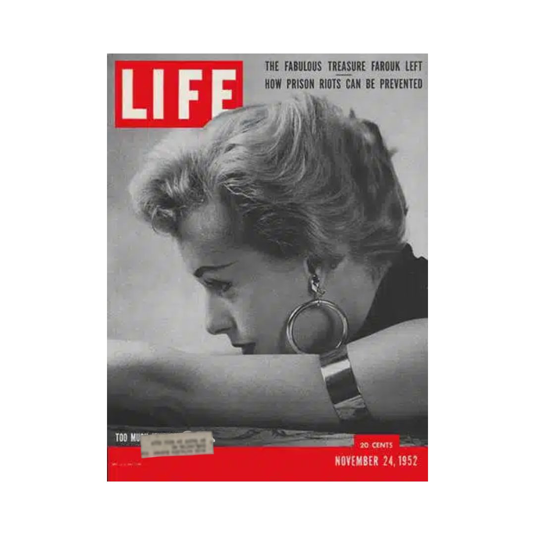 Vintage Life Magazine Cover from November 24, 1952 featuring jewelry fashion, showcasing a woman with elegant accessories against a striking red background.