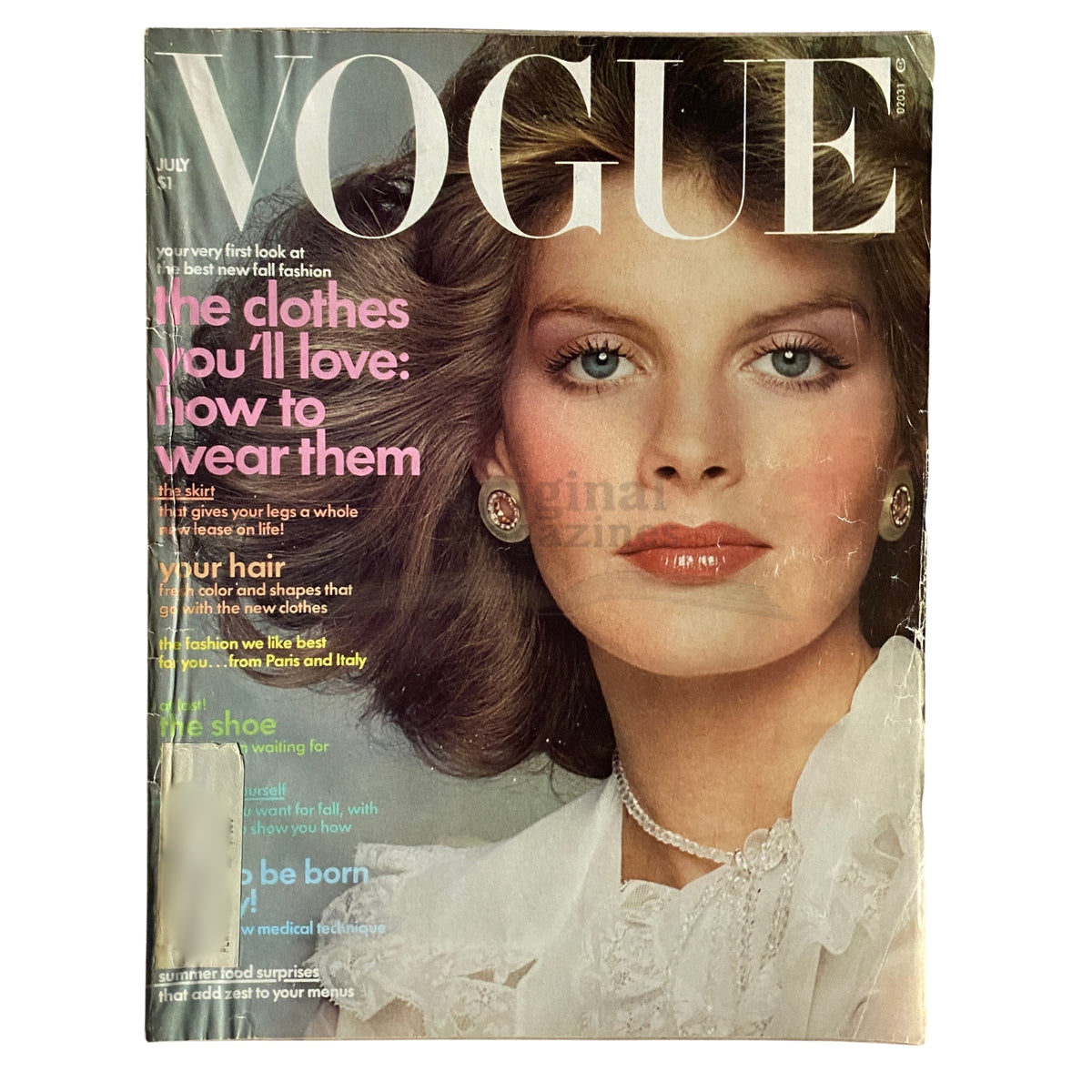Vogue Magazine July 1974 Rene Russo Cover - Vintage fashion publication showcasing model Rene Russo with classic 1970s hairstyle and makeup, highlighting bold styles and trends of the era.