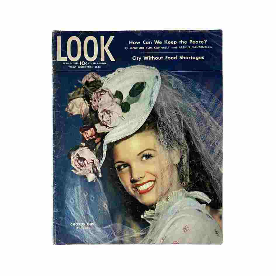 Cover of Look Magazine, April 3, 1945, featuring a smiling woman in a decorative hat with flowers, titled 'City Without Food Shortages'.