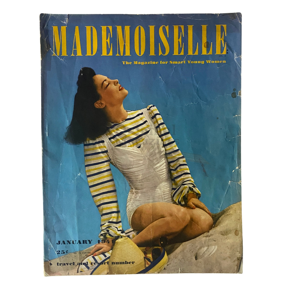 Cover of Mademoiselle Magazine January 1941 featuring a woman in a striped top and white outfit, embodying vintage travel and resort fashion from the early 1940s.