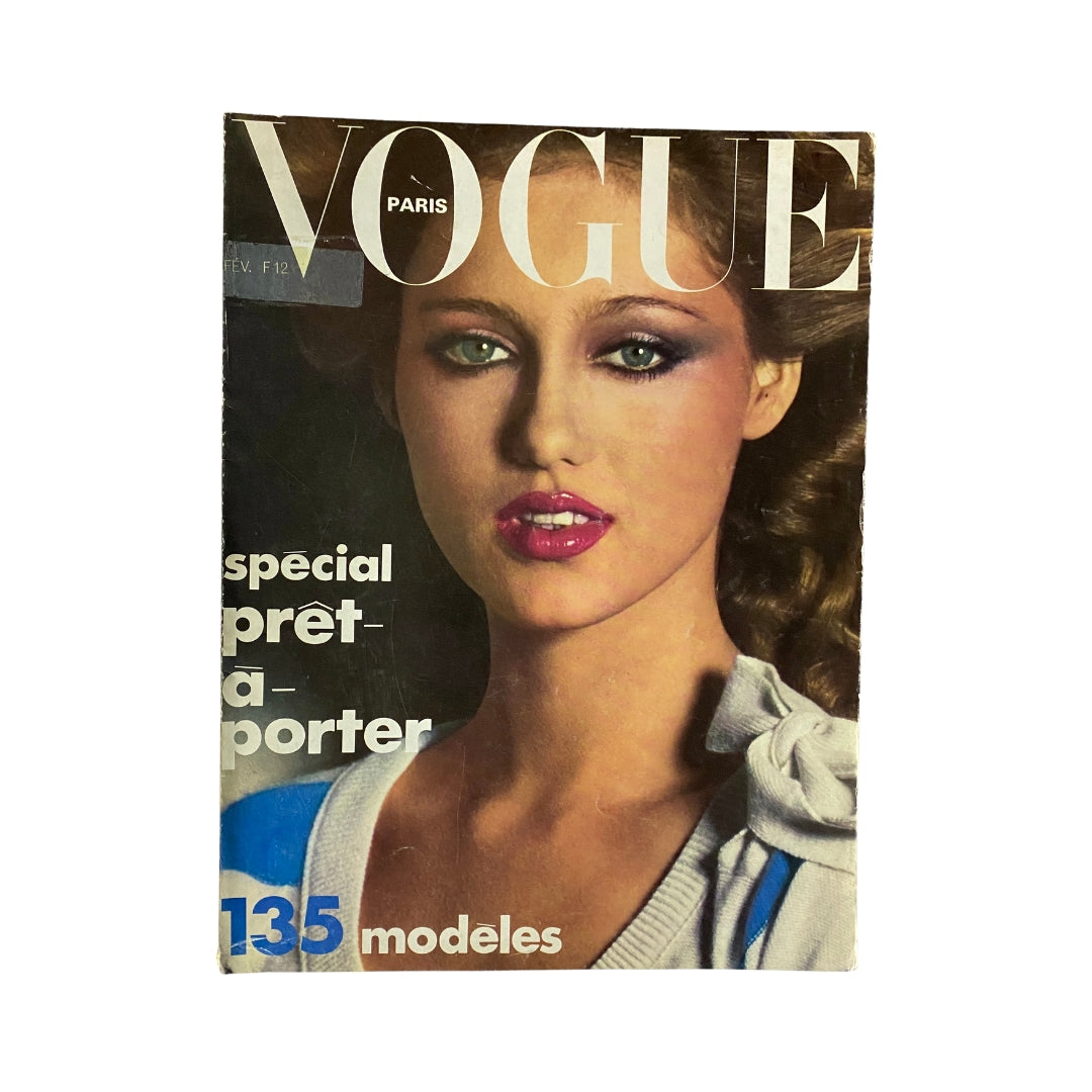 Vogue Paris Magazine February 1975 featuring Kim Alexis on the cover, showcasing the iconic 1970s fashion style with vibrant colors and bold graphics.