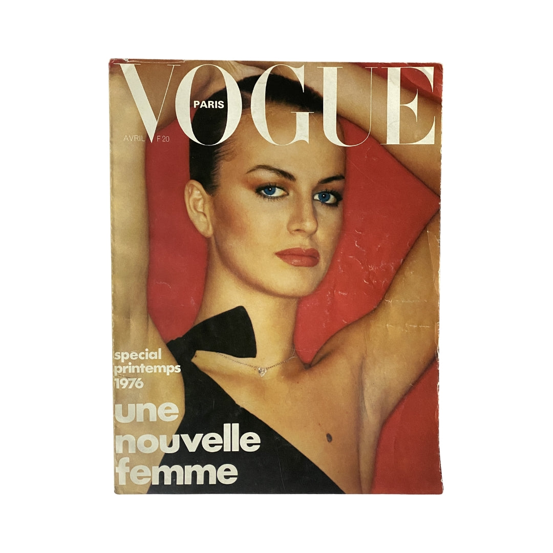Vogue Paris Magazine April 1976 Dalila Di Lazzaro Cover showcasing the model against a bright red background, emphasizing 1970s fashion trends.