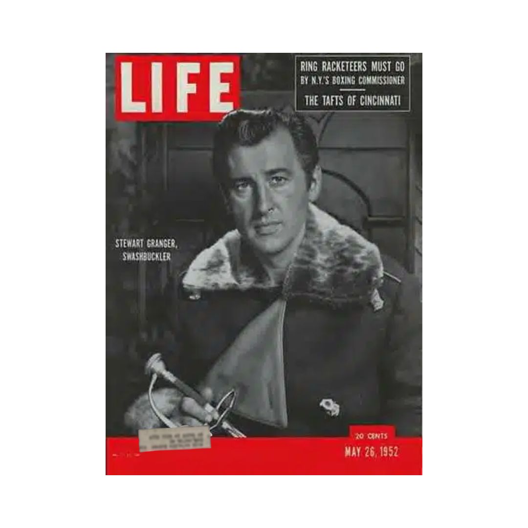 Cover of VTG Life Magazine dated May 26, 1952, featuring British film actor Stewart Granger dressed in a coat, holding a sword, with bold red lettering of 'LIFE' at the top.