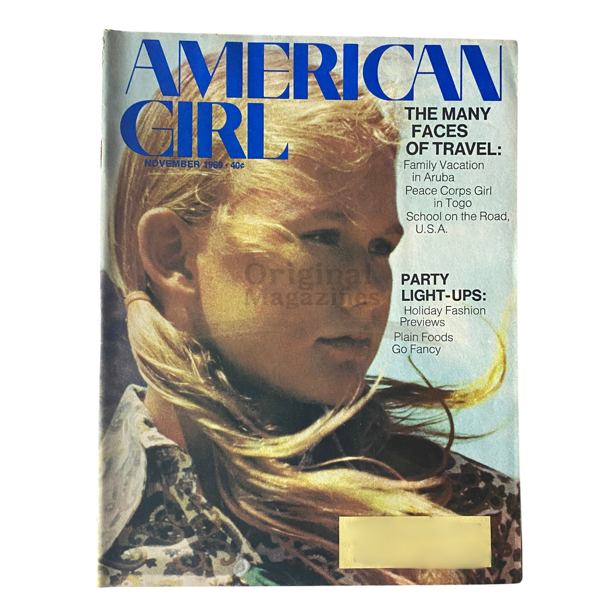 Cover of American Girl Magazine November 1969 featuring the theme 'The Many Faces of Travel', showcasing a young girl with flowing hair, highlighting travel articles on family vacations and cultural experiences.