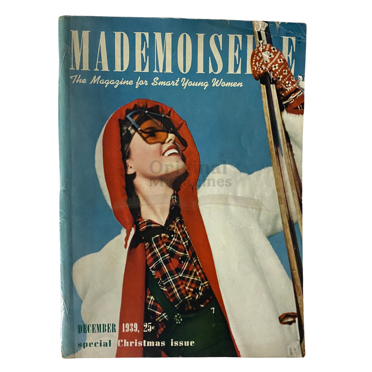 Cover of Mademoiselle Magazine December 1939 Special Christmas Issue featuring a smiling woman in winter attire against a snowy backdrop.