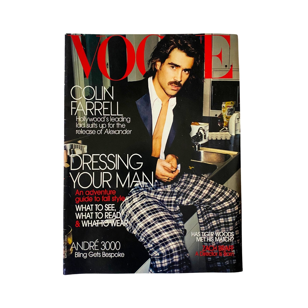 Vogue Supplement Magazine 2004 featuring Colin Farrell on the cover, showcasing a fashion theme with the title 'Dressing Your Man'. The cover includes Colin Farrell wearing stylish attire, promoting an adventure guide to men's fashion.