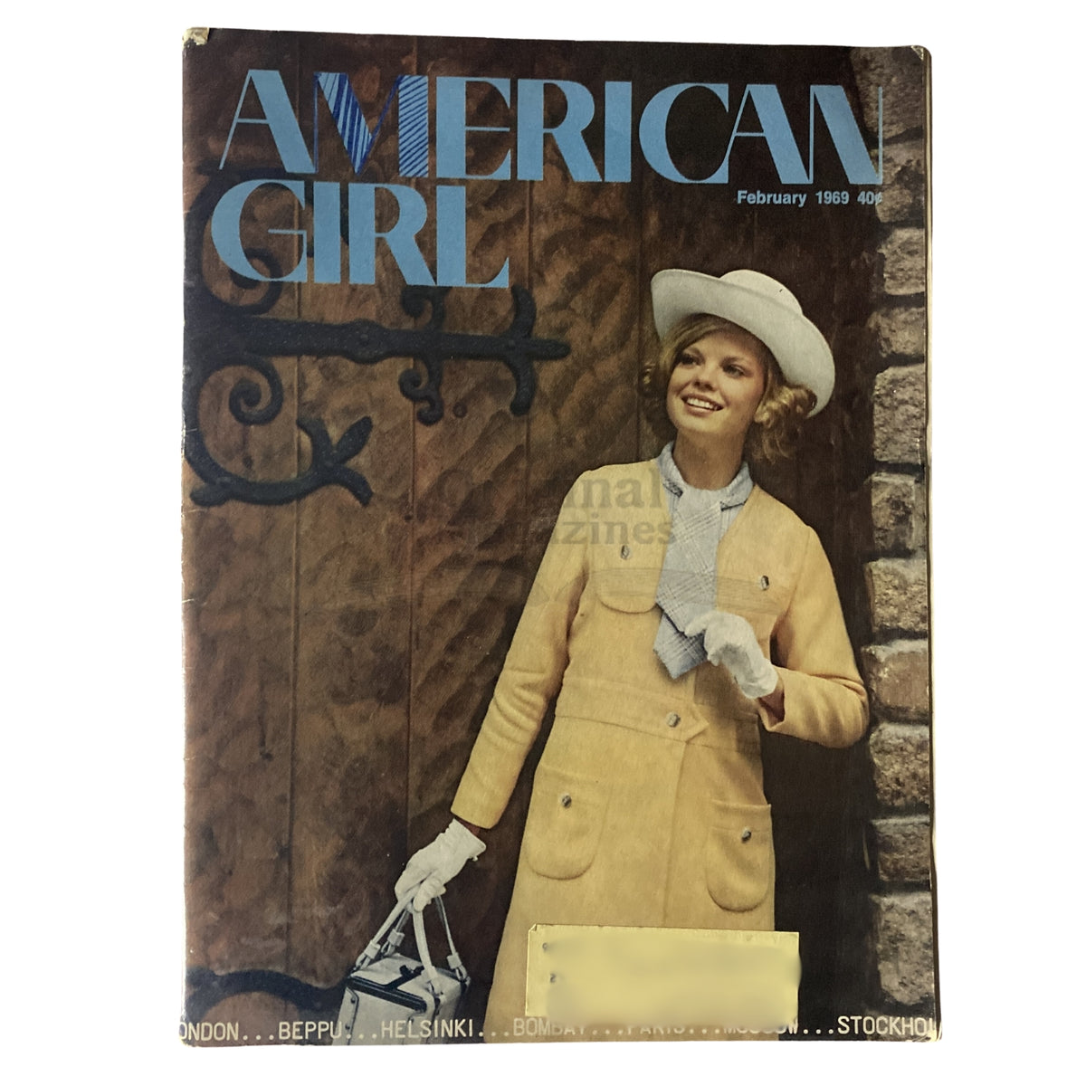 Cover of American Girl Magazine, February 1969 featuring a stylish young girl in a yellow coat and white hat, capturing the essence of Valentine's Day and 1960s youth culture.