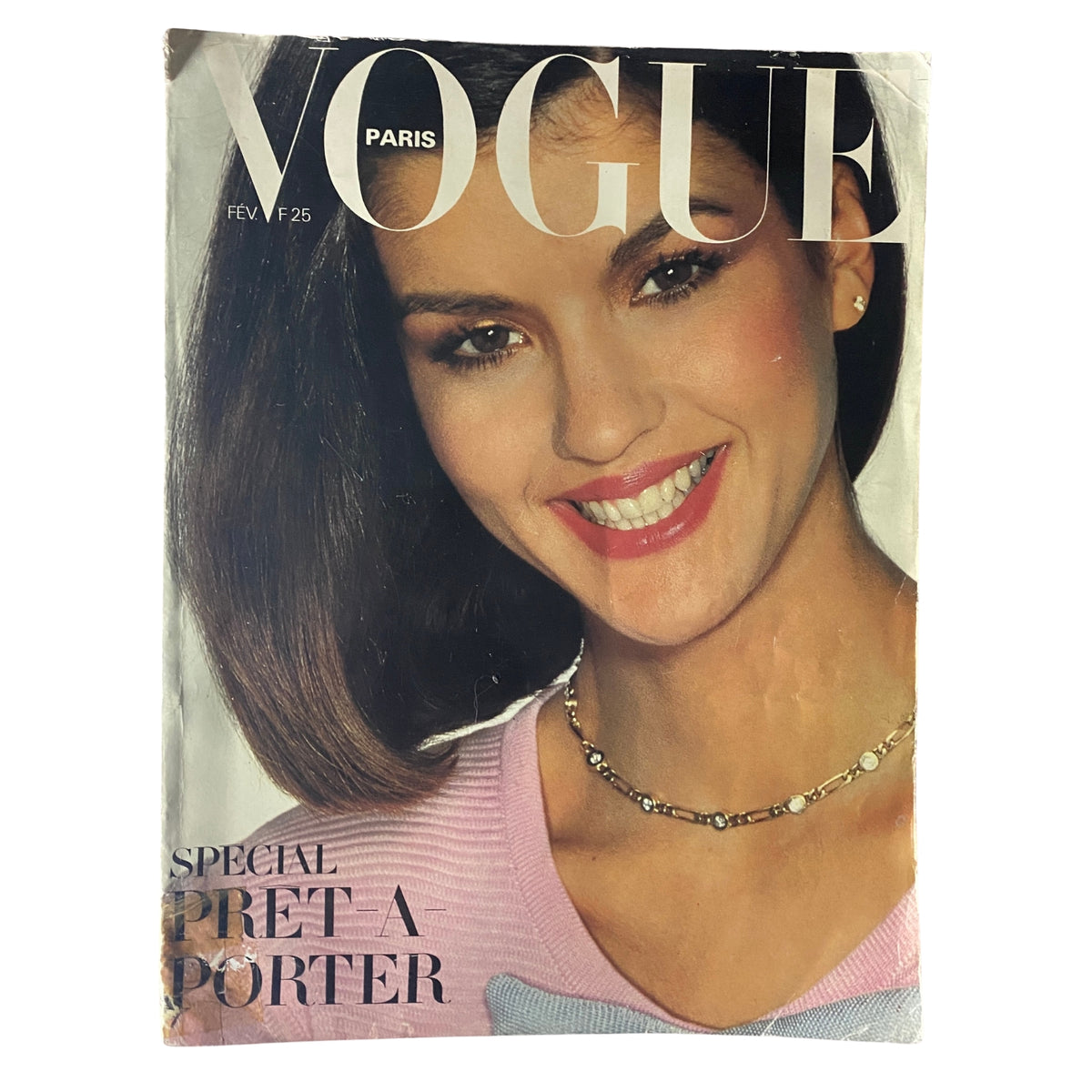 Vogue Paris Magazine February 1980 cover featuring Janice Dickinson, showcasing her stunning smile and stylish look, representing the fashion trends of the late 20th century.