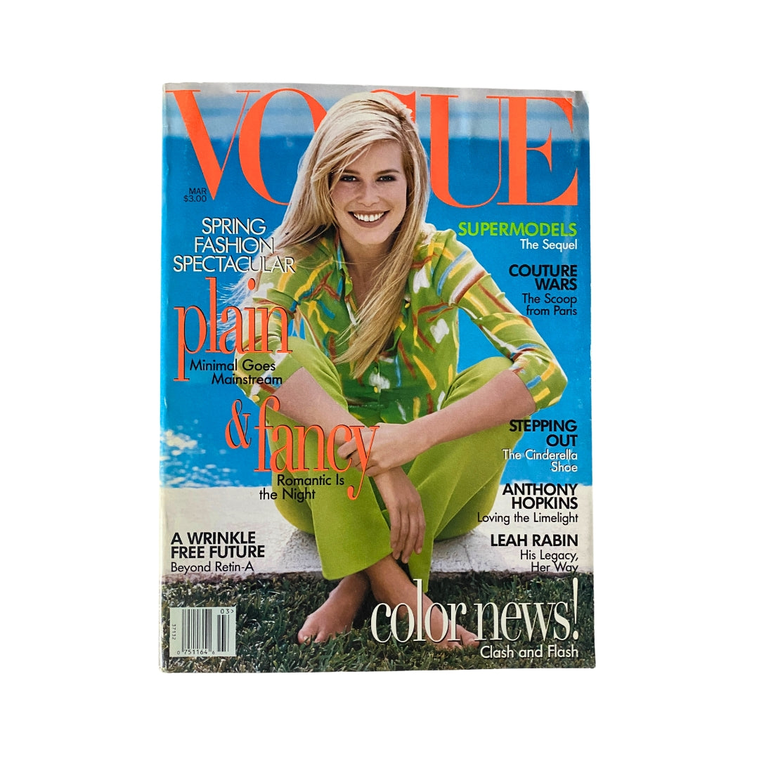 Vogue Magazine March 1996 cover featuring supermodel Claudia Schiffer, highlighting spring fashion trends with bold colors and designs.