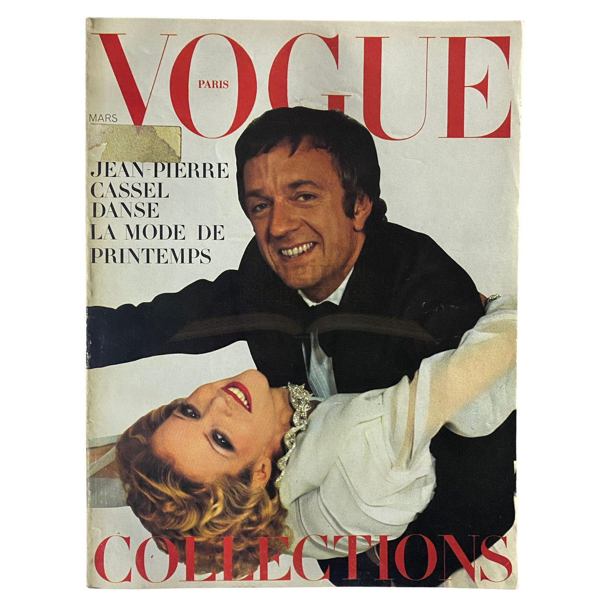 Vogue Paris Magazine March 1973 featuring Jean-Pierre Cassel and Louise Despointe on the cover, highlighting fashion trends of the early 1970s.