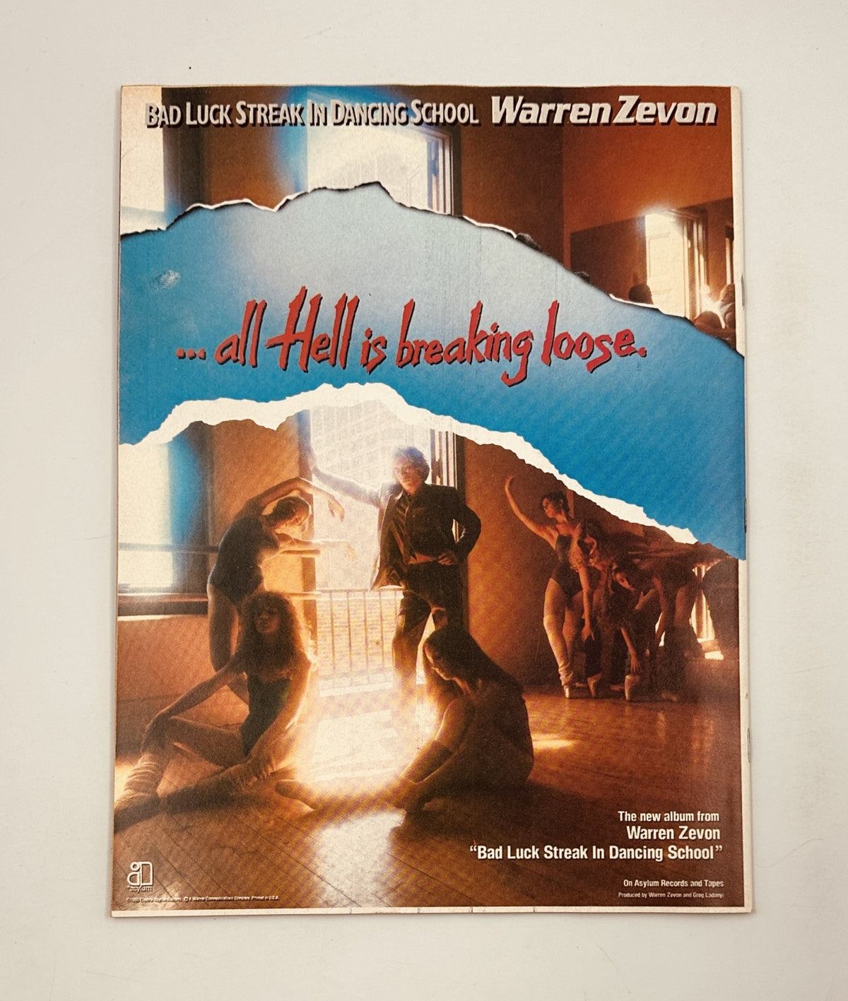 Advertisement for Warren Zevon's album 'Bad Luck Streak in Dancing School', featuring a powerful visual of dancers, included in the 1980 Circus Magazine issue.