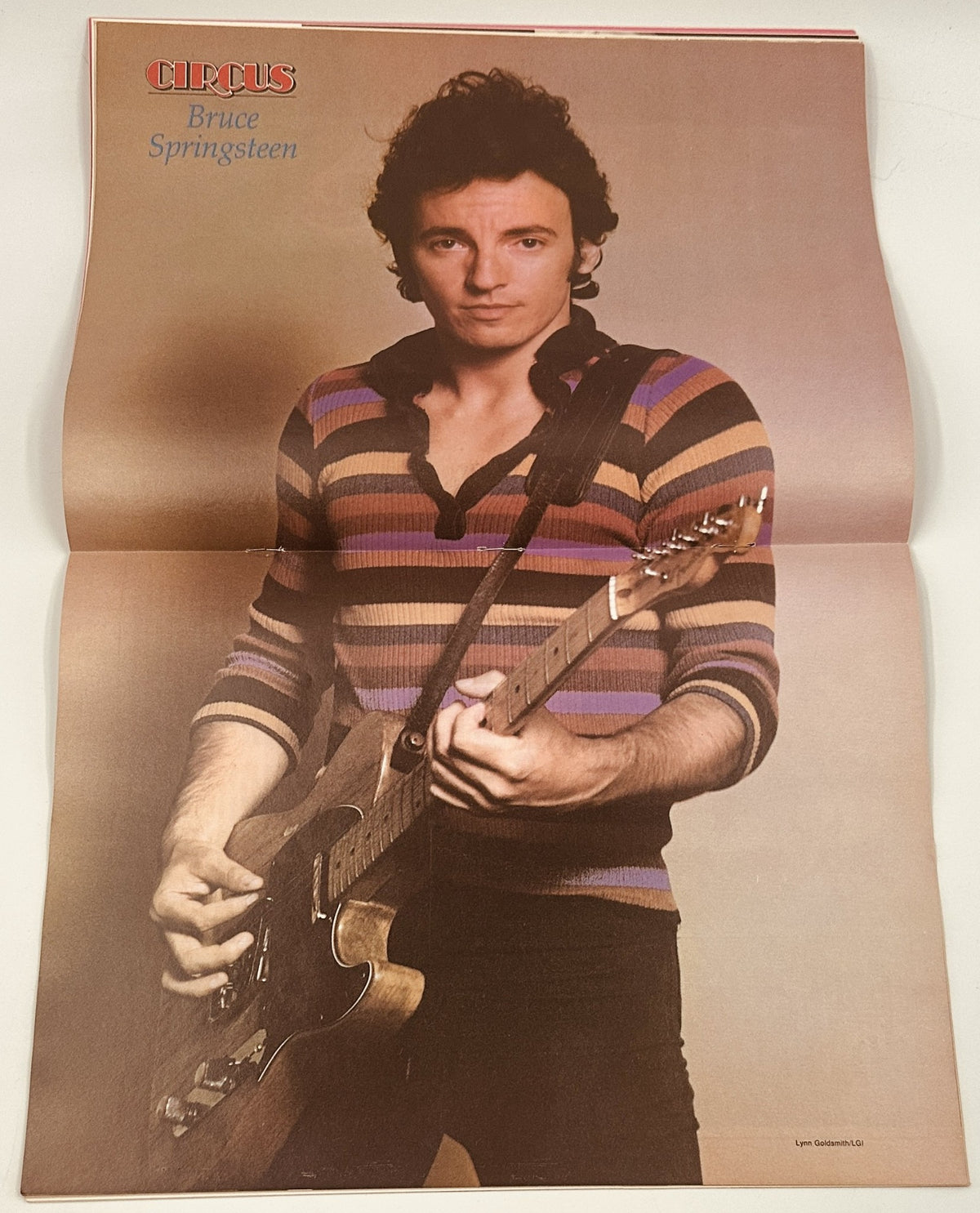Circus Magazine December 31, 1980 featuring a full-page photo of Bruce Springsteen in a striped sweater, holding a guitar.