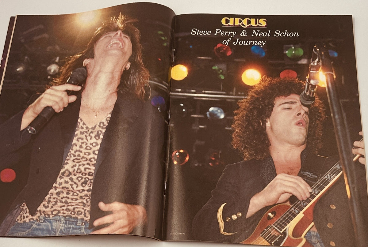 Live performance image of Steve Perry and Neal Schon from Journey featured in Circus Magazine April 30, 1982.