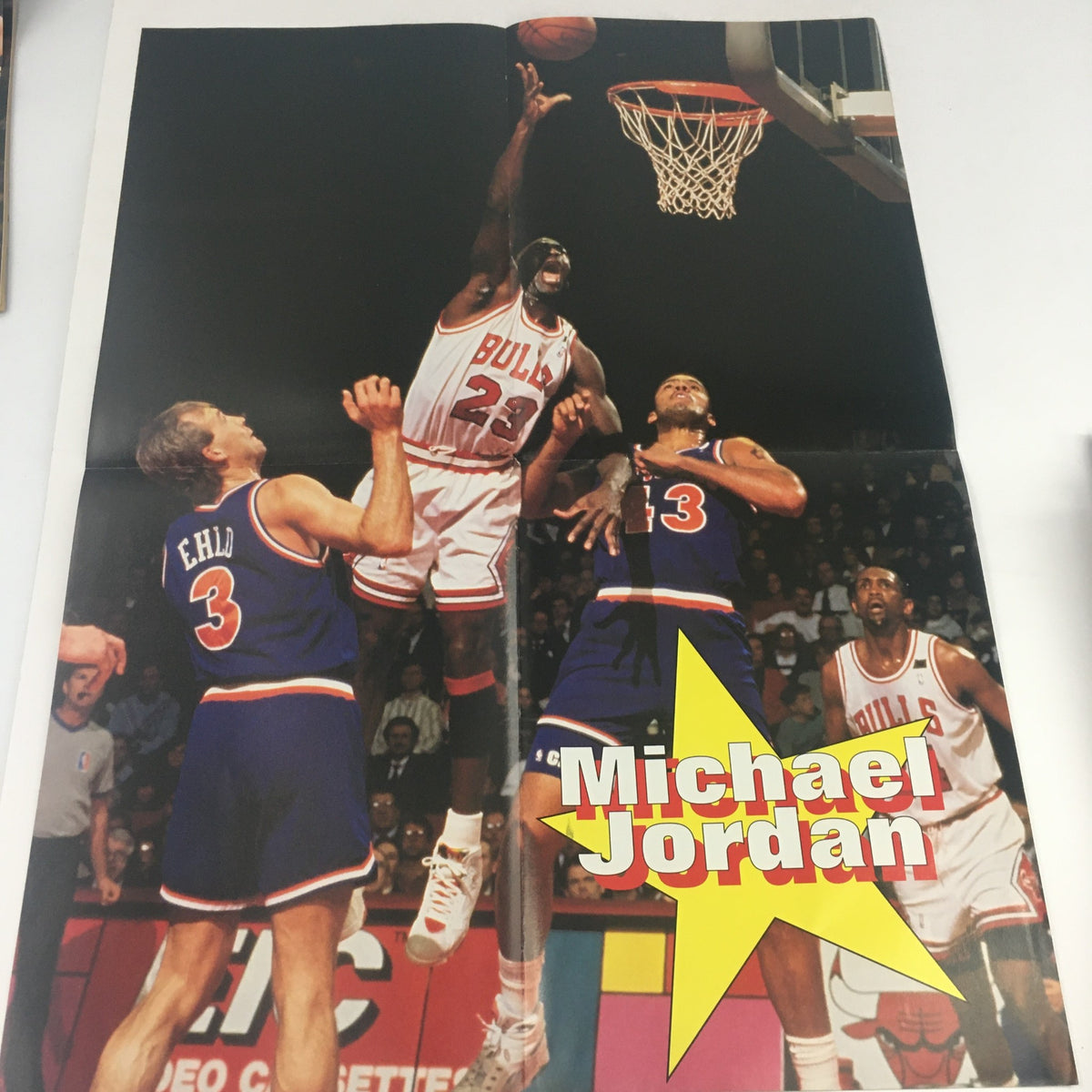 Dynamic pullout poster of Michael Jordan soaring for a dunk during a game, highlighted in Pro Basketball Illustrated Spring 1995.