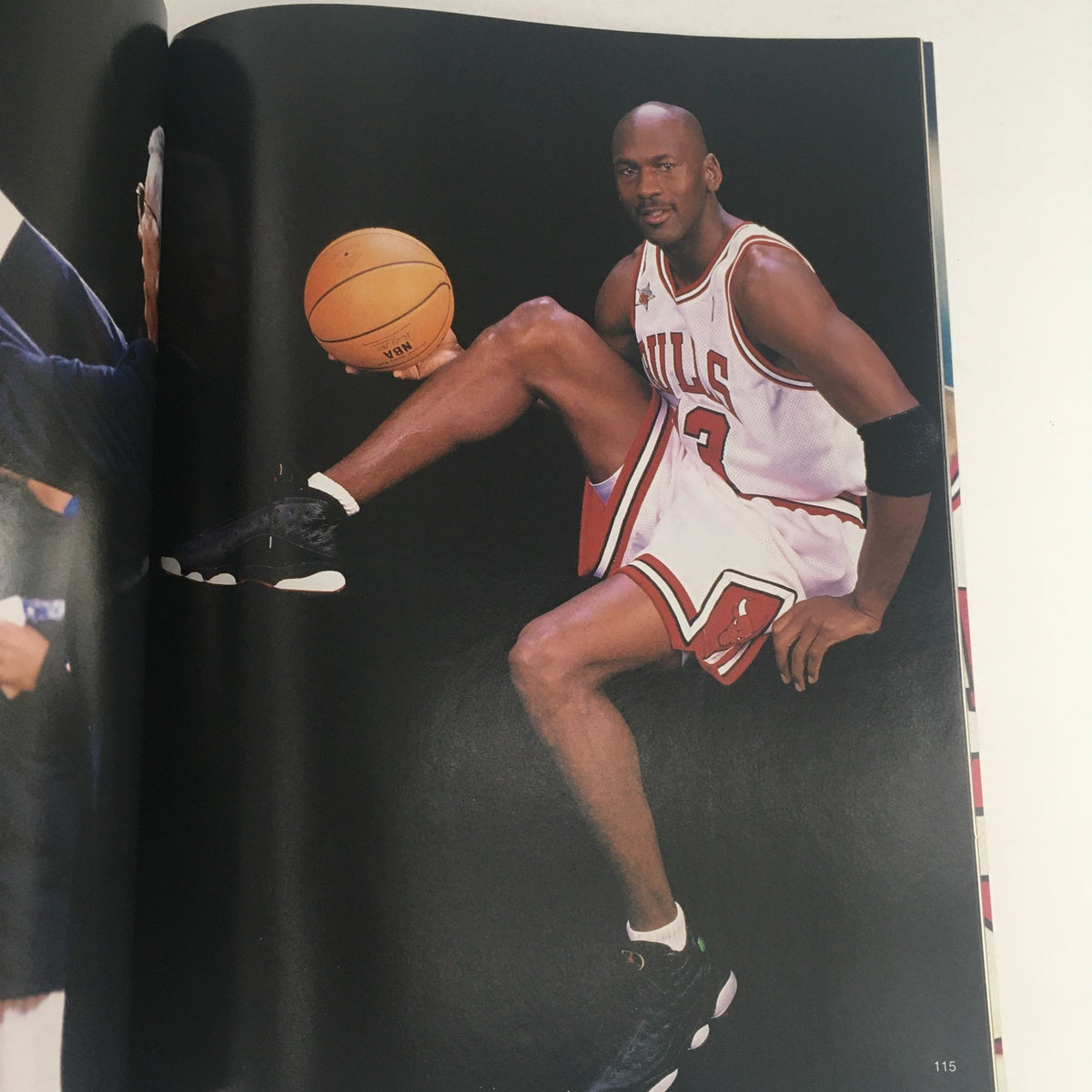 Gold Basketball Magazine 1998 featuring Michael Jordan #23, showcasing an image of Jordan sitting with a basketball, wearing his Chicago Bulls jersey, perfect for collectors of vintage sports memorabilia.